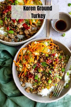 two bowls filled with rice, meat and veggies on top of a table