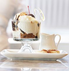 an ice cream parfait is served on a plate