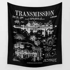 a black and white wall hanging with an image of a machine