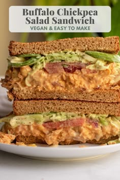 two sandwiches stacked on top of each other with the words buffalo chickpea salad sandwich vegan and easy to make