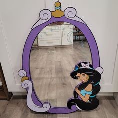 a mirror that is sitting on the floor with a cartoon character in front of it