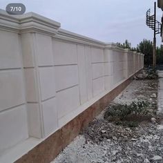 the side of a building that is being built with concrete blocks and cement bricks on it