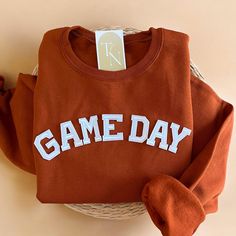 Cozy up with our Game Day Crewneck Sweatshirt this fall and Football Season! Makes the perfect gifts for mamas who love football! - Sweatshirt is super soft and comfy! ♡ - Sweatshirt composition: 50% cotton, 50% polyester - All our sweatshirts run a unisex fit. They are naturally oversized, so we normally recommend your true size. But if you like a more baggy look, we recommend sizing up. - These letters are iron-on patched and is heat pressed, not embroidered. But rest assured they've been test Sports Sweatshirt Designs, School Spirit Crew Neck Top As Gift, Fall Letter Print Sweatshirt As A Gift, Fall Letter Print Sweatshirt For Gift, Fall Letter Print Sweatshirt Gift, Fall Football Outfits, Fall Football Outfit, Game Day Sweatshirt, Football Sweater