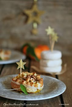 a plate with some food on it sitting on top of a wooden table next to other plates