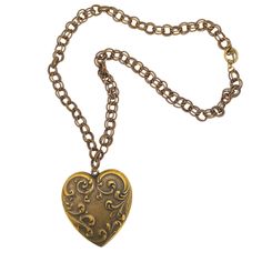 This heart necklace features a large vintage inspired heart medallion. the necklace is 22" in length and closes with a toggle clasp. The heart is 2.25" wide and 2.5" in length. It is perfect for anyone who loves vintage and also the cottagecore look. Antique Gold Heart Pendant Vintage Necklace, Vintage Antique Gold Heart Pendant Necklace, Vintage Heart Charm Necklace For Valentine's Day, Vintage Necklace For Valentine's Day, Vintage Necklaces With Vintage Charm For Valentine's Day, Vintage Brass Necklace For Valentine's Day, Antique Gold Heart Necklace With Vintage Charm, Vintage Heart-shaped Brass Necklace, Vintage Brass Locket Necklace For Valentine's Day