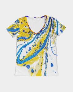 About The Art Splash A Splash of color pleases the eyes and feeds the soul. Who hasn't wanted to take a few cans of paint and splash the pains on a wall or canvas? Product Details A timeless look and a closet go-to, you can't go wrong in this Women's V-Neck Tee. Handmade from soft, breathable fabric with a slim fit and V-neckline for an everyday look to dress up or down. Soft, breathable fabric V-neckline Short sleeves Printed, cut, and handmade Size & Fit Slim fit, size up for relaxed Double ne Artsy White Summer Art, White Artsy Art For Collection, Artistic White Top With Artwork, Artsy White Artwork, White Artsy Graffiti Print Top, Artsy White Graffiti Print Top, Art Splash, V Neck Tee, The Soul