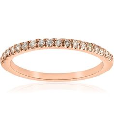 a rose gold wedding band with white diamonds