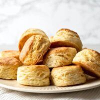 a plate full of biscuits sitting on top of a table