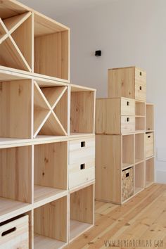 the shelves are made out of wood and have drawers