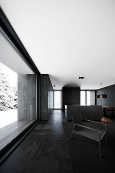 an empty room with black and white decor