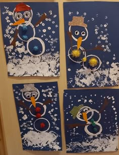 four snowmen made out of construction paper on a door with blue background and white foam