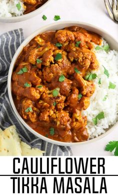 two bowls filled with cauliflower tira masala on top of white rice