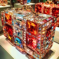 an elaborate handbag is on display in a museum