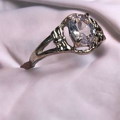 Elevate Your Style With This Stunning Cocktail Ring In Size 7, Featuring A Dazzling Oval-Shaped Cubic Zirconia. The Prong Setting Enhances The Stone's Natural Brilliance, Making It A Perfect Symbol Of Elegance And Sophistication. Whether You're Attending A Special Occasion Or Adding A Touch Of Sparkle To Your Everyday Look, This Ring Is Versatile Enough To Suit Any Event. It Also Makes A Thoughtful Gift For Her. New In Box. Keywords: Cubic Zirconia Ring, Cocktail Ring, Oval Cz Ring, Prong Settin Classic Oval Crystal Ring With Stone Setting, Classic Crystal Birthstone Ring, Anniversary Crystal Metal Ring, Oval Cubic Zirconia Crystal Ring For Formal Occasions, Classic Promise Ring With Stone Setting, Classic Crystal Ring With Stone Setting, Oval Crystal Ring With Stone Setting For Formal Occasions, Formal Oval Crystal Ring With Stone Setting, Oval Crystal Ring For Gift