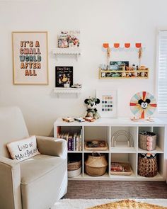 a living room filled with lots of furniture and pictures on the wall above it's bookshelf