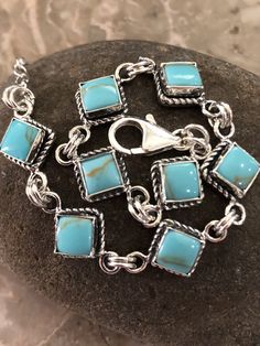 "*Brand New * Handmade item *925 Sterling silver * Gemstone: Kingman Turquoise * Link and Chain Turquoise Bracelet *Bracelet length :7\"+1\" Extensions *Free gift box *Free shipping in USA *Ready to ship *Thank you for looking and check out more items in my Etsy shop for more great items and deals! *Https://www.etsy.come/shop/abq925" Handmade Rectangular Turquoise Bracelets, Sterling Silver Turquoise Bracelet Gift, Gift Turquoise Sterling Silver Bracelet, Adjustable Square Turquoise Jewelry, Handmade Square Turquoise Jewelry, Design Bracelet, Kingman Turquoise, Tiffany Heart, Heart Charm Bracelet