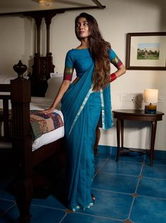 Summer perfect blue soft woven Kota saree edged with a Zari border. Festive Blue Cotton Silk Pre-draped Saree, Diwali Cotton Silk Pre-draped Saree With Border, Blue Cotton Silk Pre-draped Saree With Zari Work, Blue Cotton Silk Pre-draped Saree For Diwali, Blue Cotton Silk Pre-draped Saree With Zari Weaving, Festive Blue Handloom Pre-draped Saree, Blue Pre-draped Saree With Unstitched Blouse For Puja, Blue Chanderi Pre-draped Saree For Diwali, Cotton Silk Pre-draped Saree With Border