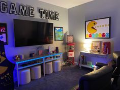 a living room filled with furniture and a flat screen tv mounted to the side of a wall