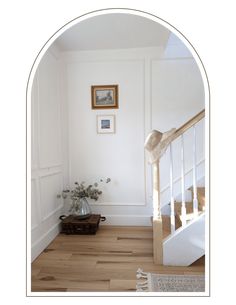 a room with white walls and wooden floors