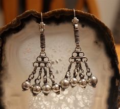 These Silver Tribal Earrings make a bold statement!  Boho tribal style, OOAK and fit for a goddess! The perfect fit for the adventurous! Earrings measure 2.75 inches in length. Traditional Dangle Chandelier Earrings, Sterling Silver Dangling Beads Earrings For Festival, Festival Sterling Silver Earrings With Dangling Beads, Traditional Long Drop Earrings For Pierced Ears, Traditional Long Drop Earrings With Dangling Beads, Festival Dangle Chandelier Earrings, Festival Oxidized Dangle Danglers, Festival Oxidized Finish Dangle Danglers, Metal Dangle Plug Earrings For Festivals