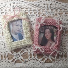 two small pictures are placed next to each other on a lace doily with pink ribbon