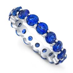 a white gold ring with blue sapphire stones