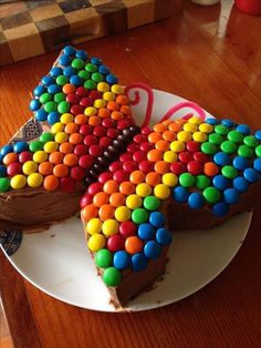 a piece of chocolate cake decorated with colorful candy