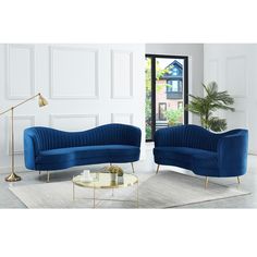 a living room with two blue couches and a coffee table