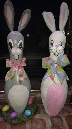 two decorated easter bunnies sitting next to each other