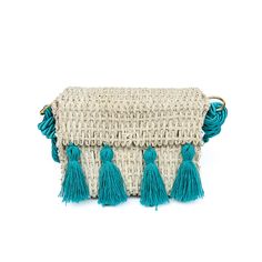 This chic Straw Crossbody Teal bag is great for any occasion. With its unique crossbody style and teal pompoms, it adds a touch of style and personality to any outfit. The lightweight design ensures comfortable and effortless all-day wear. *Each bag is a one-of-a-kind creation, meticulously handmade. Embrace the beauty of imperfection as slight variations in pattern or minor imperfections make every piece special. Own a truly unique accessory that tells a story of craftsmanship and individuality Turquoise Shoulder Bag For Summer Vacation, Blue Bags With Tassels For Vacation, Turquoise Travel Bag For Spring, Trendy Turquoise Shoulder Bag, Spring Travel Turquoise Bags, Blue Summer Shoulder Bag With Tassels, Blue Shoulder Bag With Tassels For Summer, Blue Tassel Shoulder Bag For Summer, Chic Turquoise Crossbody Bag