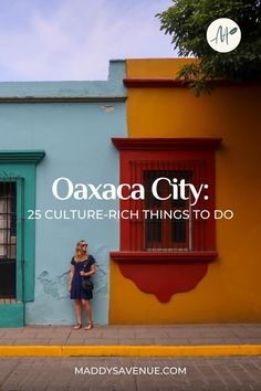 a woman standing in front of a colorful building with the words oakac city 25 culture - rich things to do