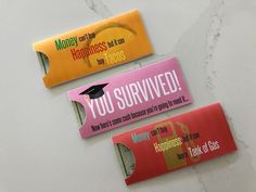 three business cards with the words you survived and money can't get back on them