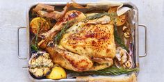 a roasting pan filled with chicken and vegetables