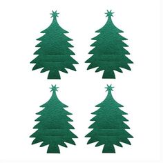 four green felt christmas trees on a white background