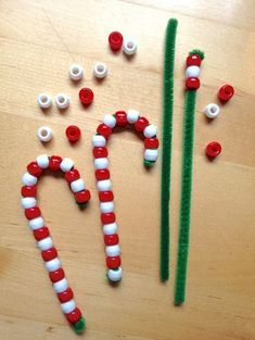 some candy canes are laying on the floor next to other items that have been made out of them