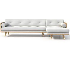 a white couch sitting on top of a wooden frame