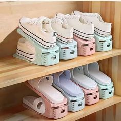 there are many pairs of shoes on the shelves in this room and one is pink, blue, green, white