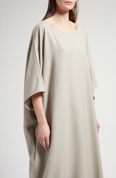 Slouchy dolman sleeves and a softly scooped neckline play up the oversized cocoon shape of this insouciant midi dress made from soft cashmere. 48" length (size Medium) Slips on over head Scoop neck Elbow-length sleeves Side-seam pockets 100% cashmere Dry clean Made in Italy Designer Clothing Elegant Oversized Short Sleeve Midi Dress, Cocoon Dress, Scooped Neckline, Elbow Length Sleeve, Nordstrom Dresses, Dolman Sleeve, Dress Making, The Row, Designer Clothing