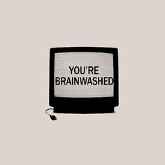 a black and white television with the words you're brainwashed written on it