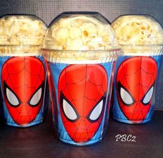 three plastic cups filled with macaroni and cheese covered in spider - man faces