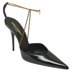 GUARANTEED AUTHENTIC SAINT LAURENT BLACK PATENT LEATHER CLAW CHAIN PUMPS Retail excluding sales taxes $1,590. Details: - Black patent leather uppers. - Pointed toe. - Antique gold ankle chain with hanging YSL logo. - Claw clasp closure. - Self covered heels. - Leather lining and sole. Size: 38.5 Measurements (Approx): - Insole 10.5" - Heel 4.5" Condition: Excellent - Worn a very few times. - Uppers look clean. - Very light insole and sole/heel wear. - Please Note, These shoes are Pre-owned. We make every effort to make note of all visible exceptions. Please review all detailed pictures carefully and ask questions prior to purchase. final sale. Gold Ankle Chain, Black Patent Leather Pumps, Ysl Heels, Ankle Chain, Patent Leather Pumps, Black Patent Leather, Patent Leather, Clothing And Shoes, Leather Upper