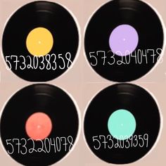 four different colored discs with numbers on them