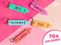 four different colored name tags on pink and blue paper with the words jolie, havet, alexanner, eva