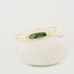 Ruby Zoisite Bangles, Ruby Zoisite 7x25mm Oval Shape Gemstone Silver Bracelet, Handmade Gold Plated Bezel Set Bracelet, Gift For Wife Item Code: BJ7517 Metal: 925 Sterling Silver Plating: 18K Gold Micron Stone Detail: Ruby Zoisite 7x25mm Oval Shape * Please note that there will be slight variations in stone texture and color shades in the actual product that you receive. Stone quality or grade will be same. * All our jewelry is Micron Plated which is higher quality as compared to Standard Platin Jewelry For Girls, Bezel Earrings, Set Bracelet, Make Your Own Jewelry, Ruby Zoisite, Stone Texture, Jewelry Show, Gold Plated Bracelets, Handmade Gold