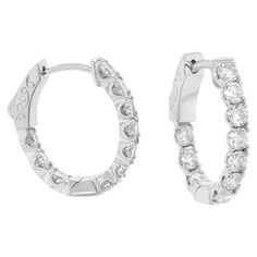 14 kt white gold, .50" oval hoop earrings featuring 1.65 cts tw round diamonds Diana M. is a leading supplier of top-quality fine jewelry for over 35 years. Diana M is one-stop shop for all your jewelry shopping, carrying line of diamond rings, earrings, bracelets, necklaces, and other fine jewelry. We create our jewelry from gemstones and diamonds of the highest quality (GIA certified) as well as the highest quality of gold and platinum to deliver magnificent, exquisite items that will bring a Jewelry Shopping, Jewelry Earrings Hoops, Diamond Rings, Round Diamonds, Platinum, Fine Jewelry, Jewelry Earrings, Hoop Earrings, White Gold