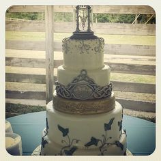 a three tiered cake sitting on top of a table