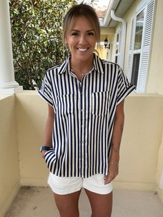 Add a splash of color to your outfit with these incredible satin button downs! 100% Polyester featuring a collar neckline, shell style buttons, permanent rolled sleeves, single front pocket, and hi-lo hem. Model is 5'5" 32B size 6 wearing a small Cc Beanie, Rolled Sleeves, Argyle Sweater, Layer Dress, Dress Romper, Sun Hats, Panama Hat, Front Pocket, Color Splash