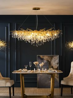 an elegant dining room with chandelier, chairs and a large painting on the wall