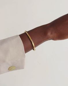 DETAILS : ▪ Materials: high-quality 316L medical stainless steel▪ 18k gold coating▪ Available in 3 width options▪ The model is wearing 4mm width bangle▪ The inner circumference of the bracelet is 17.5cm / 6.9 inches▪ Secure closure▪ Hypoallergenic▪ Nickel free▪ Will not darken▪ Non tarnish▪ Water resistant▪ Shipps from Berlin MATERIALS : ▪ This eye-catching and classy bangle is made of high-quality, durable, and water-resistant 316L stainless steel. 316L stainless steel is mainly used in medical Gold Elegant Wristband With Bracelet Strap, Everyday Tarnish Resistant Cuff Bangle, Classic Bracelet Wristband, Everyday Yellow Gold Cuff Jewelry, Tarnish Resistant Cuff Bracelet For Formal Occasions, Timeless Tarnish Resistant Bangle Bracelet, Formal Tarnish Resistant Cuff Bracelet, Formal Tarnish-resistant Cuff Bracelet, Classic Gold Cuff Bracelet