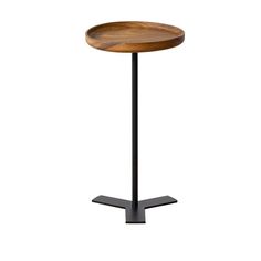 a round wooden table with black metal legs